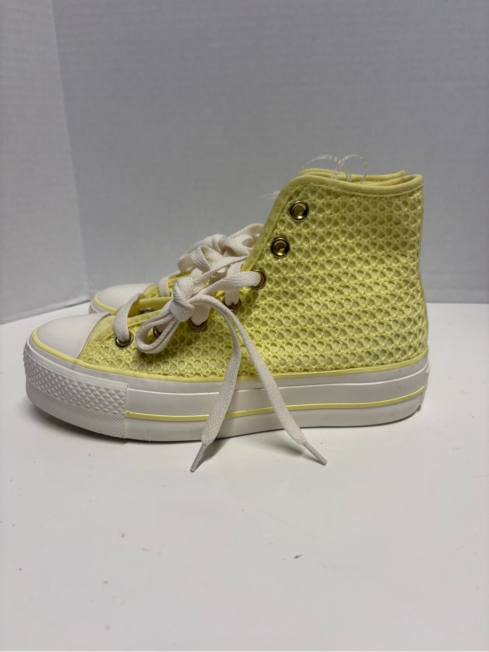 Womenβs Converse All-Star High-Top Sneakers in Pastel Yellow and White